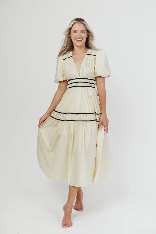 Midi dresses with keyhole backs for a flirty and unexpected detail Bradley Puffed Sleeve Tiered Maxi Dress in Cream/Black Midi dresses with keyhole backs for a flirty and unexpected detail Bradley Puffed Sleeve Tiered Maxi Dress in Cream/Black