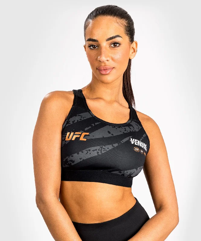 Distressed Women T Shirt with a Laid - Back AestheticUFC Adrenaline by Venum Fight Week Women’s Sports Bra - Urban Camo Distressed Women T Shirt with a Laid - Back AestheticUFC Adrenaline by Venum Fight Week Women’s Sports Bra - Urban Camo