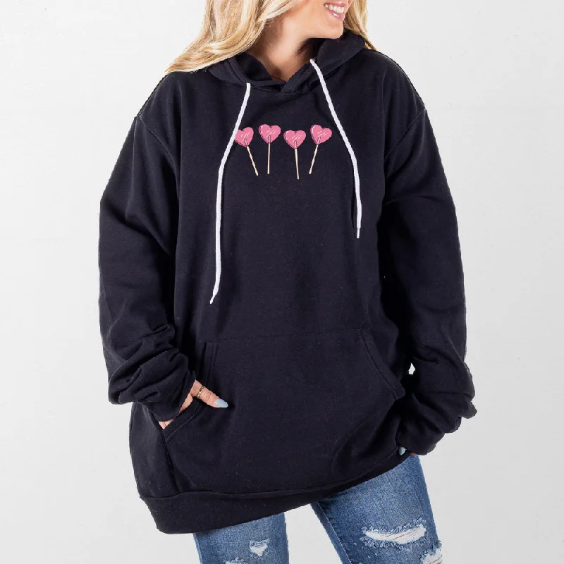 Women's cropped sweatshirt with a slogan graphic for a fun and expressive lookHeart Lollipops Giant Hoodie Women's cropped sweatshirt with a slogan graphic for a fun and expressive lookHeart Lollipops Giant Hoodie