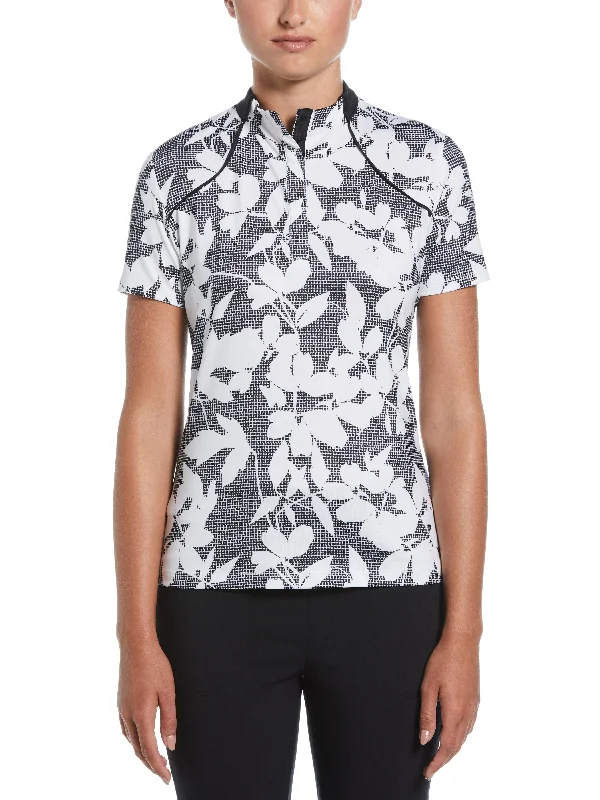 Sheer mesh panel polo shirt for a trendy twistWomens Textured Abstract Floral Print Golf Polo with Snap Placket Sheer mesh panel polo shirt for a trendy twistWomens Textured Abstract Floral Print Golf Polo with Snap Placket