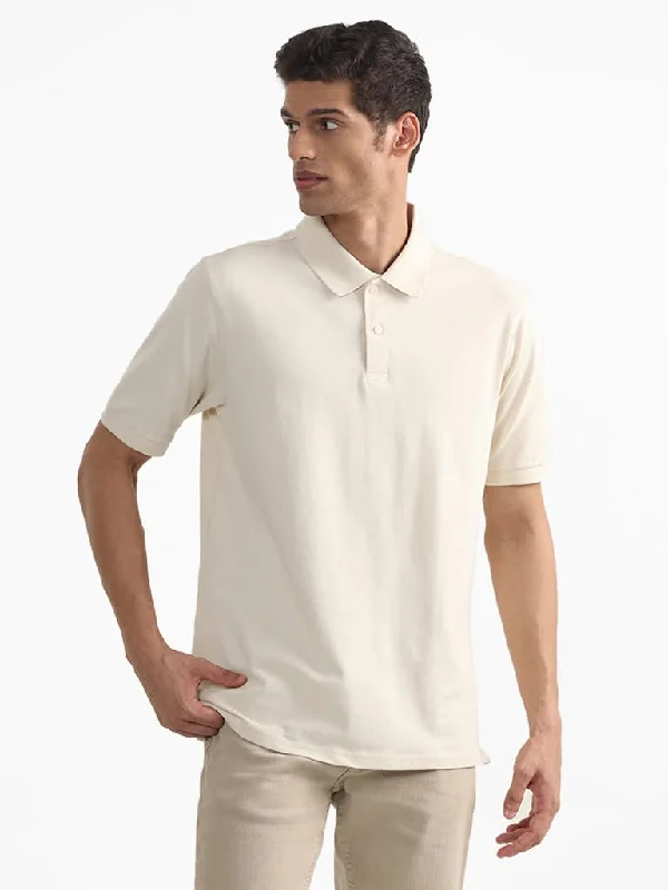 Belted Women Shorts to Enhance the WaistlineWES Casuals Plain Cream Polo Neck Cotton Blend Relaxed-Fit T-Shirt Belted Women Shorts to Enhance the WaistlineWES Casuals Plain Cream Polo Neck Cotton Blend Relaxed-Fit T-Shirt